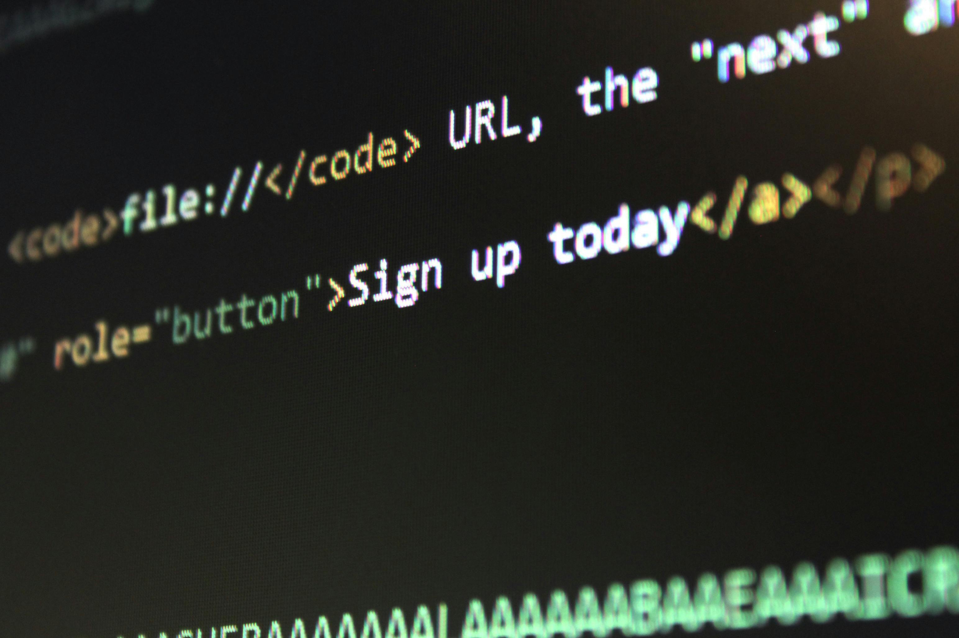 Close-up of HTML code displayed on a computer screen, highlighting a dofollow link and button role, representing web development and coding concepts.